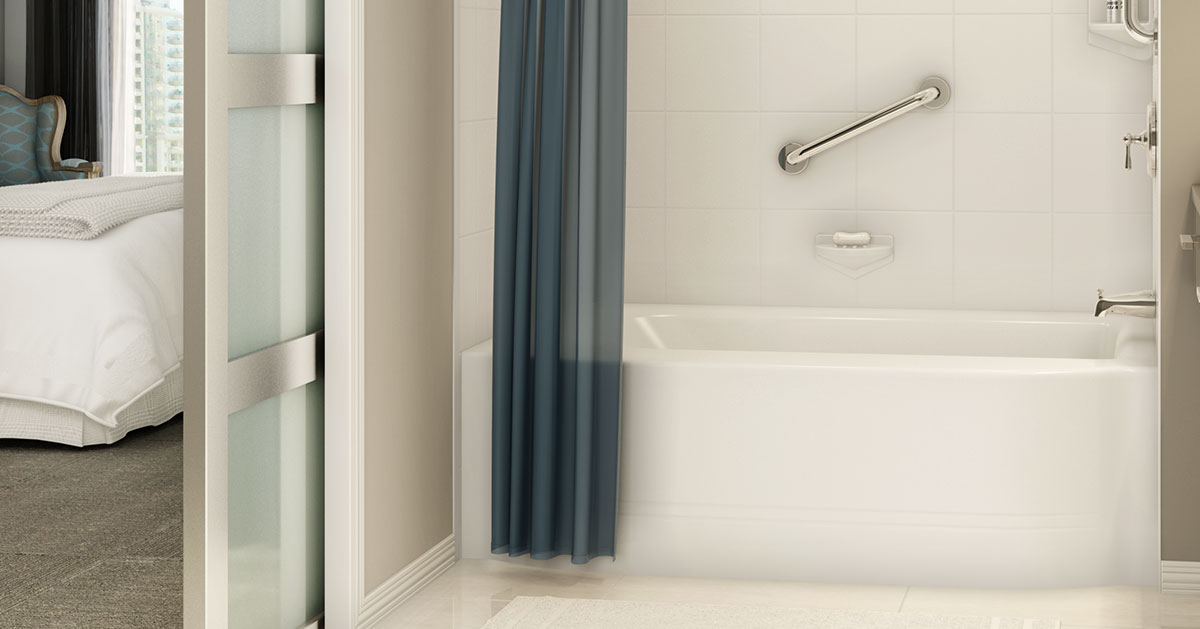Hotel bathroom with empire bathtub and blue shower curtain